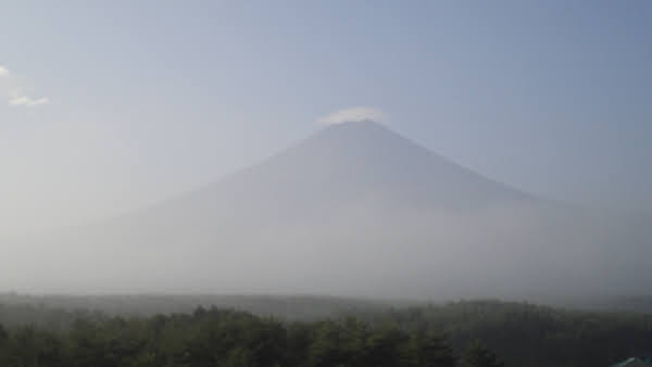 Mount Fuji with a haze covering the lower portion